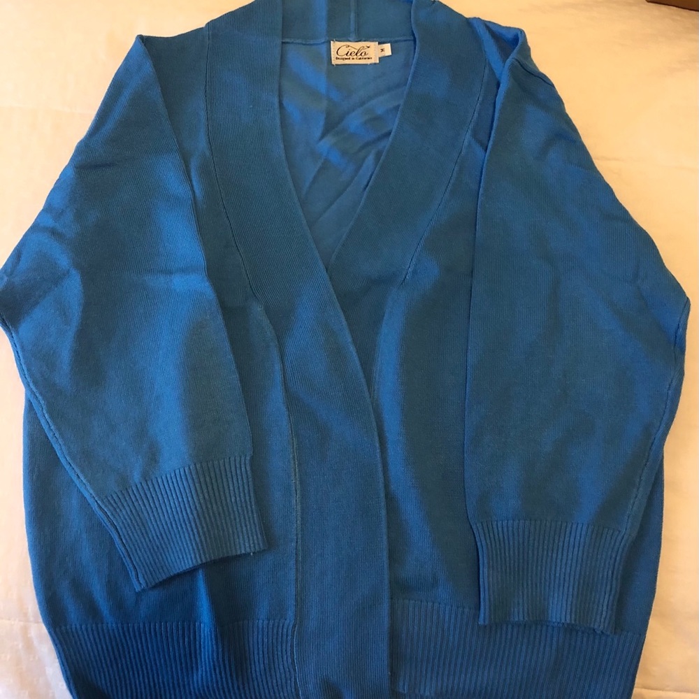 Blue short jacket with tags